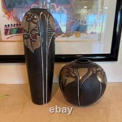 Pair of Studio art pottery vases created by the artist Amil