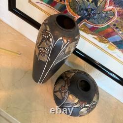 Pair of Studio art pottery vases created by the artist Amil