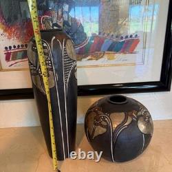 Pair of Studio art pottery vases created by the artist Amil