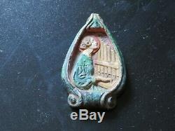 Three Compton pottery arts and crafts pendants, circa 1910