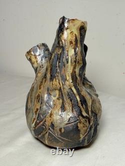 Vintage handmade brutalist American pottery anatomical heart shaped vase